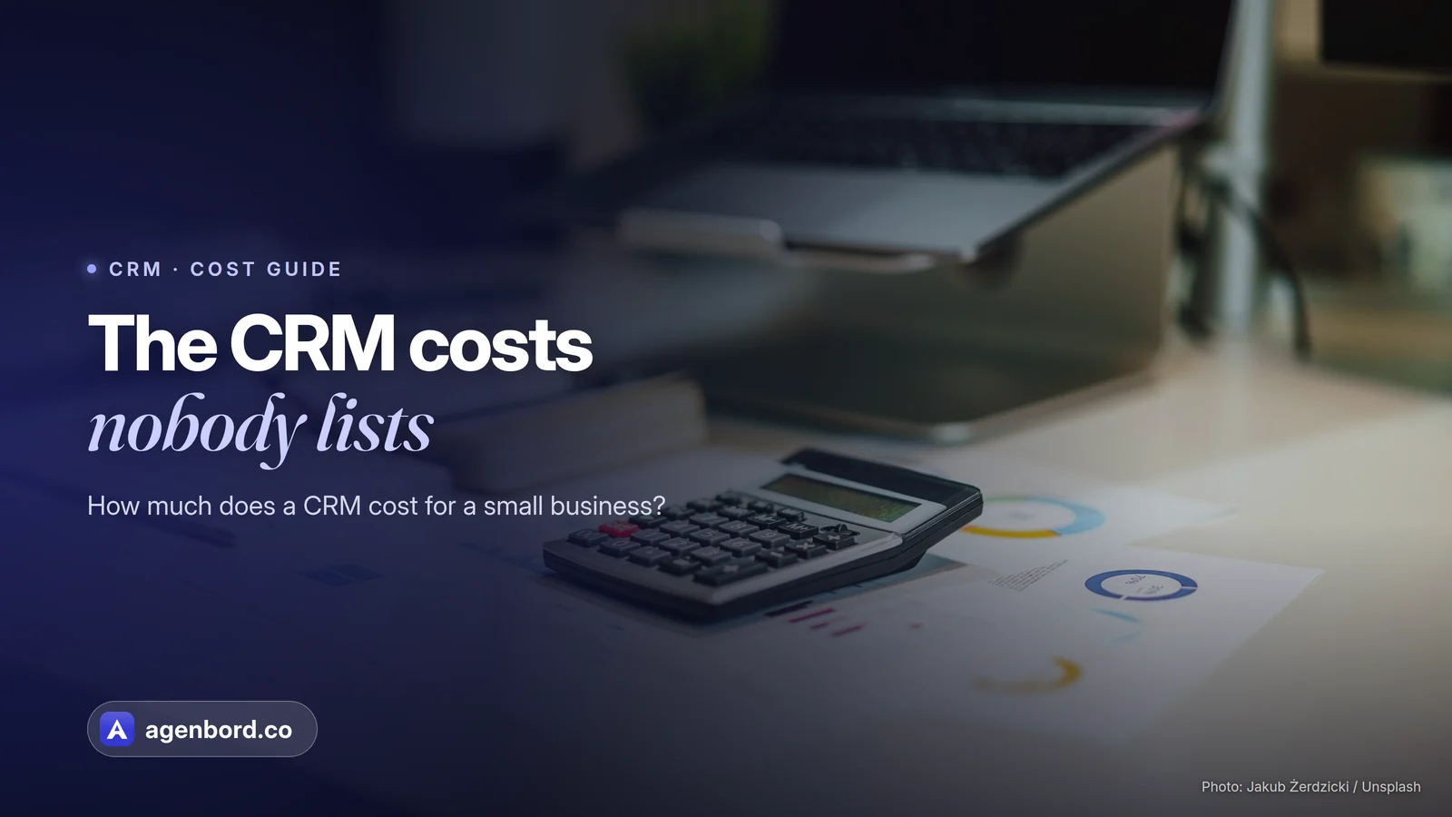 A calculator on printed charts beside a laptop. Headline: The CRM costs nobody lists